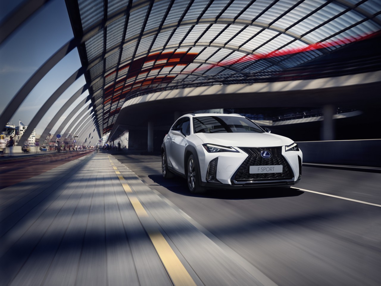 Side view of the Lexus UX driving 