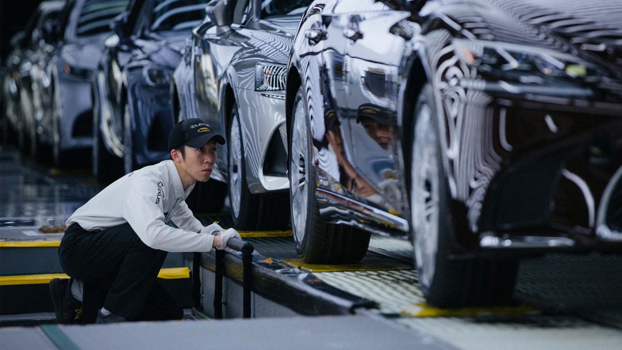 A mechanic working on a Lexus