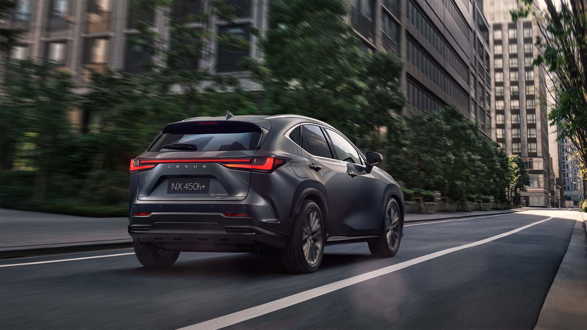 Lexus NX driving in a city location 